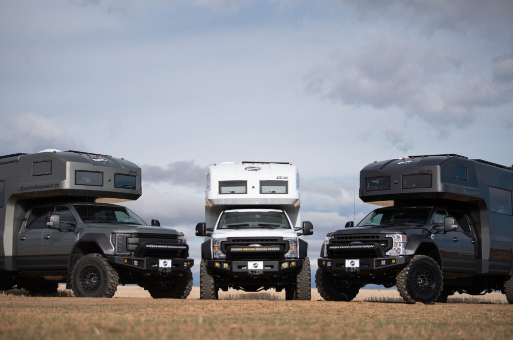Three Earthroamers LTi 4WD campers parked in the desert