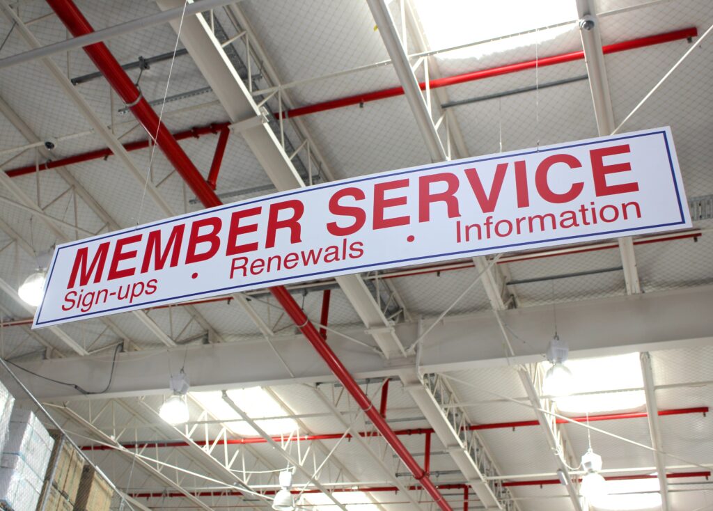 A sign inside Costco that says "Member Service: Sign-ups, Renewals, Information". You do have to be a member when buying an RV through Costco. 